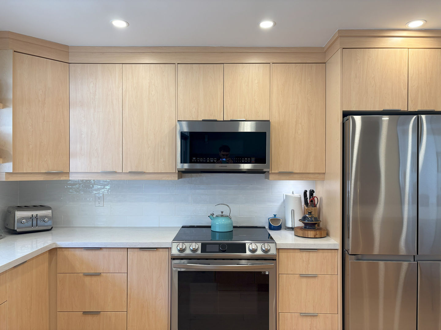 natural colored kitchen with kettle on the stove in King City