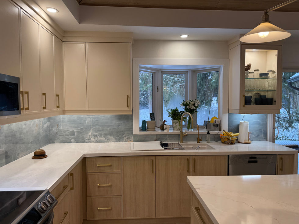 kitchen with warm lighting and natural colored cabinets
