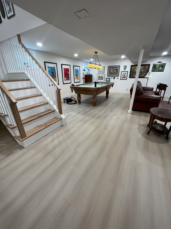 White luxury vinyl plank in a basement made by Pearl Knstructions