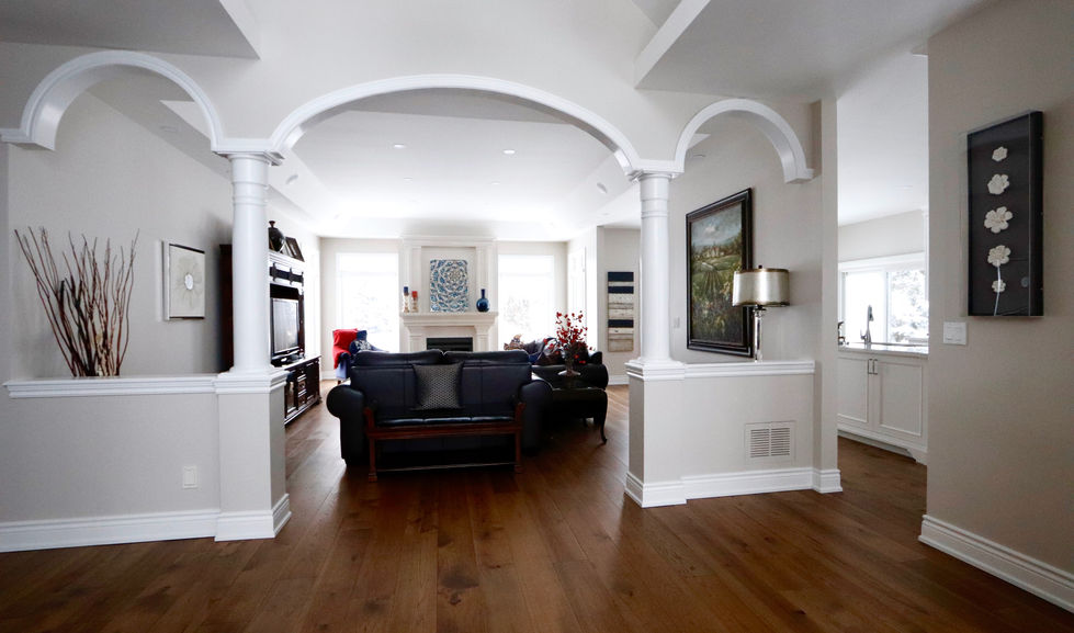 Arched walls and brown engineered hardwood