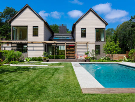 modern home backyard with lawn and pool.