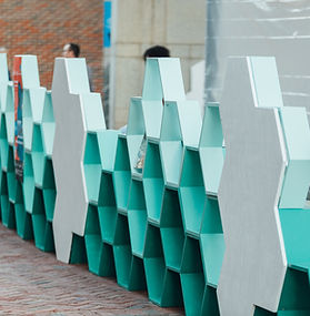 Man painting a portion of the art installation at Salem Pop-up Parklet