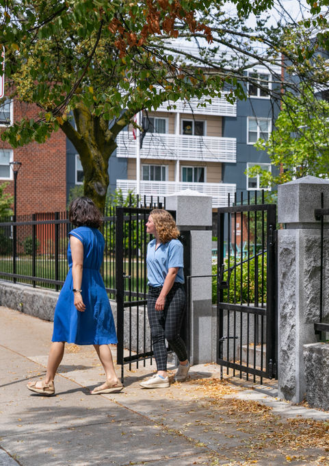 granite wall and pillars mark the entrance to the courtyard - Crowley Cottrell LLC Landscape Architecture
