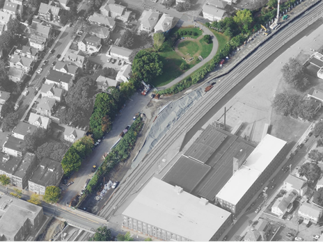 drone image of a park being constructed alongside the train tracks.