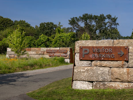 entrance to parking lot at halibut point state park.