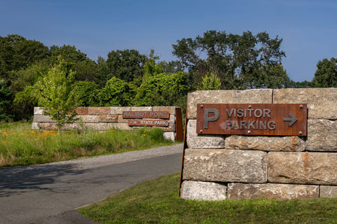 entrance to parking lot at halibut point state park.