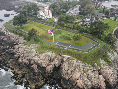 drone image of a park on a rocky outcropping overlooking the water.