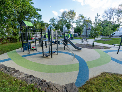 playground with strips of bright blue and green playsurfacing