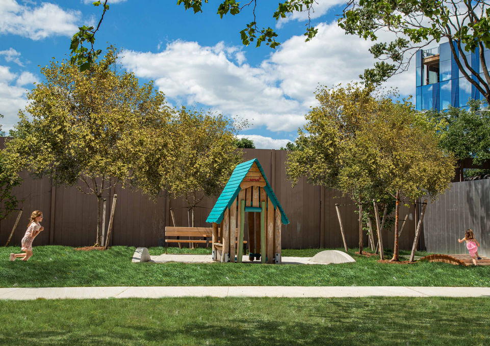 children run past wooden playhouse surrounded by young trees at Flaherty Park - Crowley Cottrell LLC Landscape Architecture
