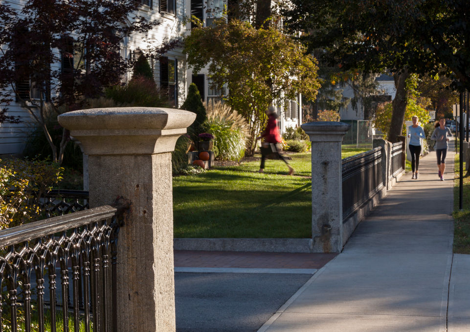 Stone columns and iron fence flank the entry drive to Concord Academy - Crowley Cottrell LLC Landscape Architecture