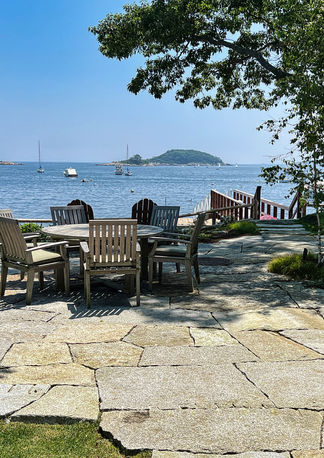 Outdoor stone patio overlooking ocean