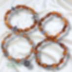 “Set of 4 handmade olive wood corded bracelets from Bethlehem, Holy Land, displayed together on a neutral background.