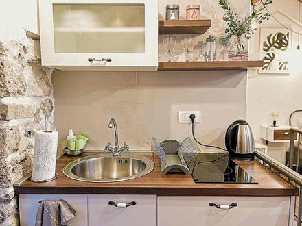 Fully equipped kitchenette in Laurel suite showing cooking facilities