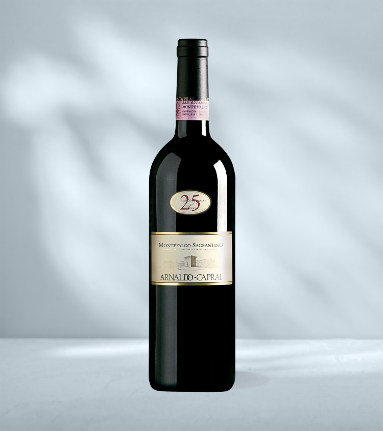 Bottle of Arnaldo Caprai Montefalco Sagrantino 25th Anniversary red wine with label featuring "25 Anni" in gold and black