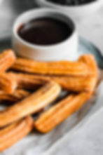 Cinnamon churros in chocolate sauce