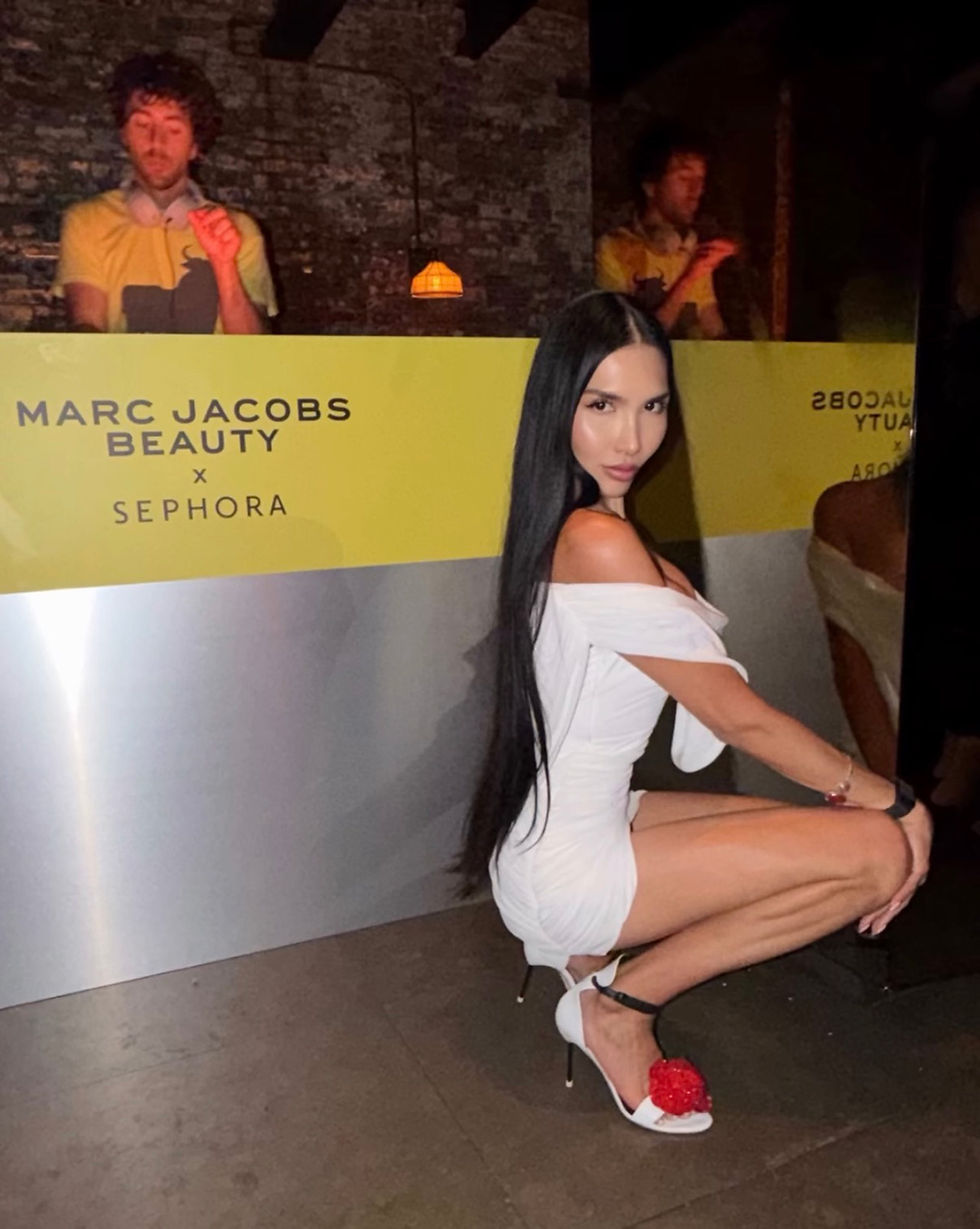 Zarina Yeva wearing Giseli Dias Audrey White sandals with red floral details at the Marc Jacobs Beauty × Sephora party.