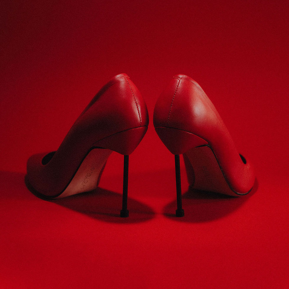 classic designer pumps in red with black heels