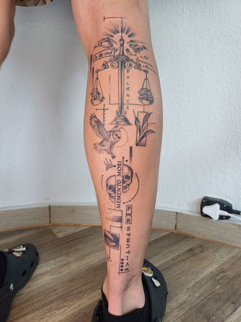 A calf tattoo with mulitple elements done in a black and grey new school minimal geometric style
