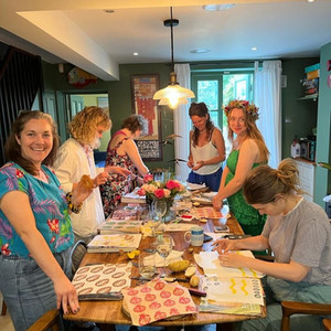 A group of friends celebrating a birth with a printing workshop