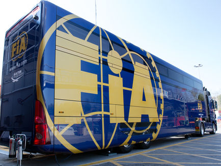 The back of an FIA transporter truck parked in a Formula 1 paddock