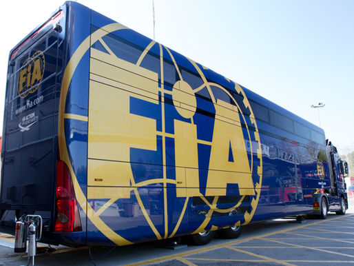 The back of an FIA transporter truck parked in a Formula 1 paddock