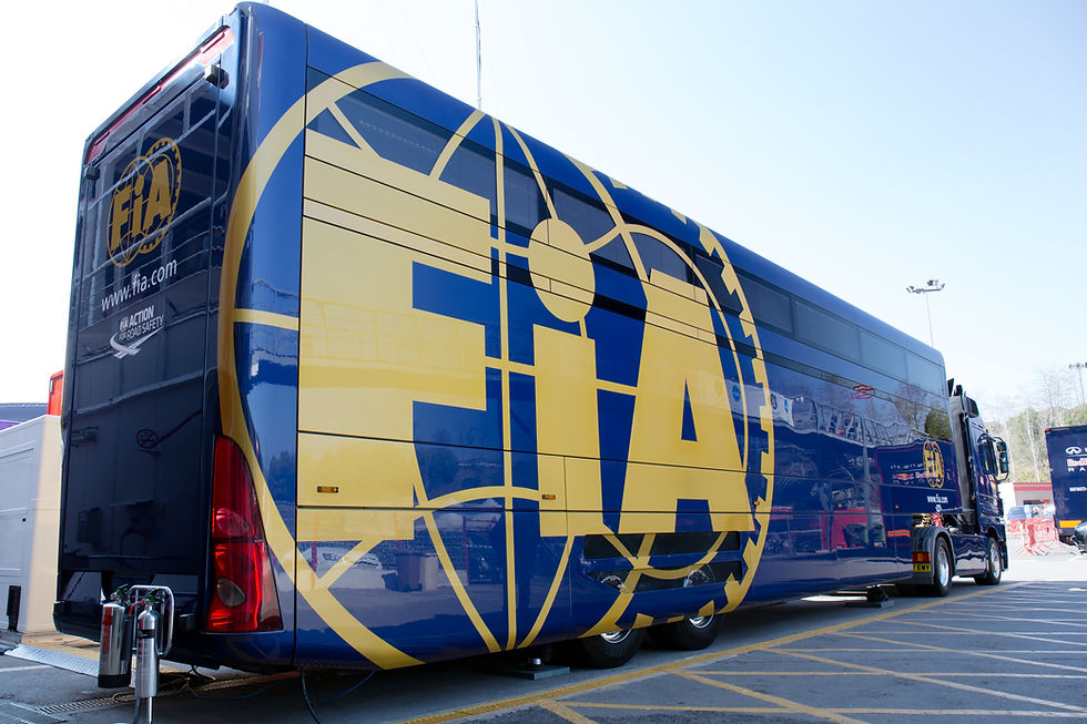 The back of an FIA transporter truck parked in a Formula 1 paddock