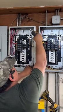 Electrician installing and wiring residential electrical panels for a house – Campos Electric Solutions professional electric