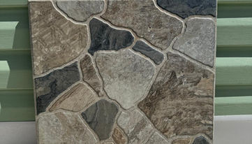 42.5x42.5 ölçülerinde kabartmalı taş desenli yer fayansı 