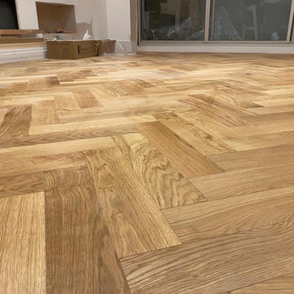 close up natural wood Herringbone floor construction by local kent carpenters IJB carpentry