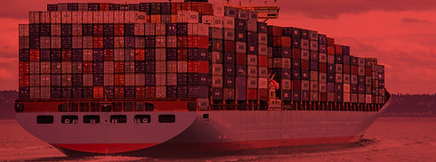 blue and red cargo ship on sea during da