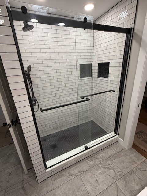 Bathroom remodel shower door installed.