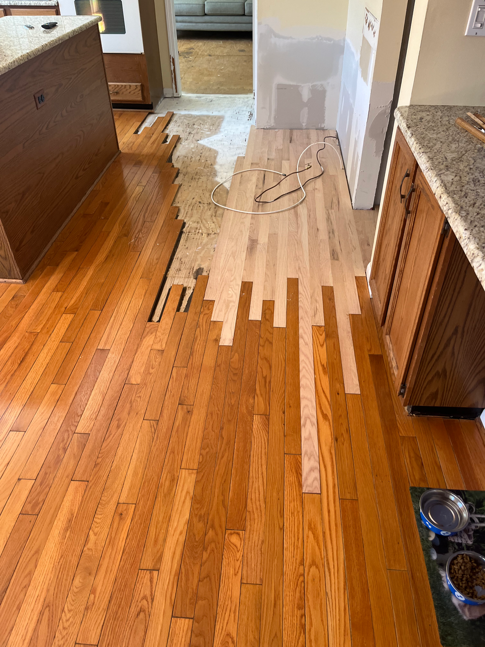 New flooring interlocked with existing flooring.