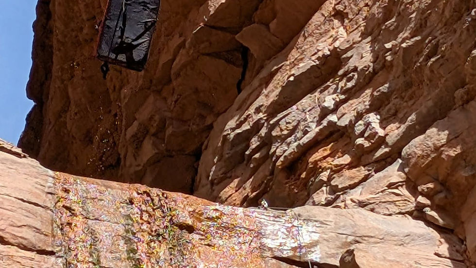 Bouldering pad flying off the final rappel in Rock Canyon Arizona.