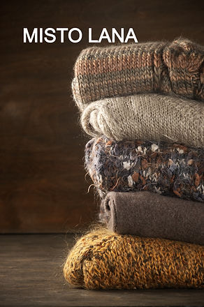 Stack%20of%20knitted%20sweaters%20on%20w