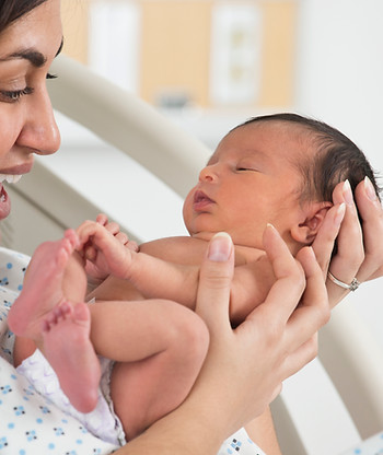 woman holding newborn