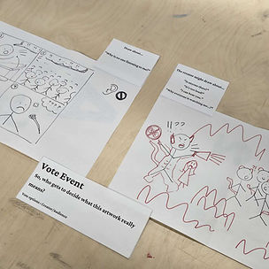 The end of a round on a wooden table: the Creator's four-panel black drawing, the Audience's red version, the cards "Draw about… Why is no one listening to me?" and "The creator might draw about…", and a Vote Event card asking who gets to decide what the artwork really means.