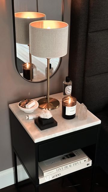 black nightstand with black bed