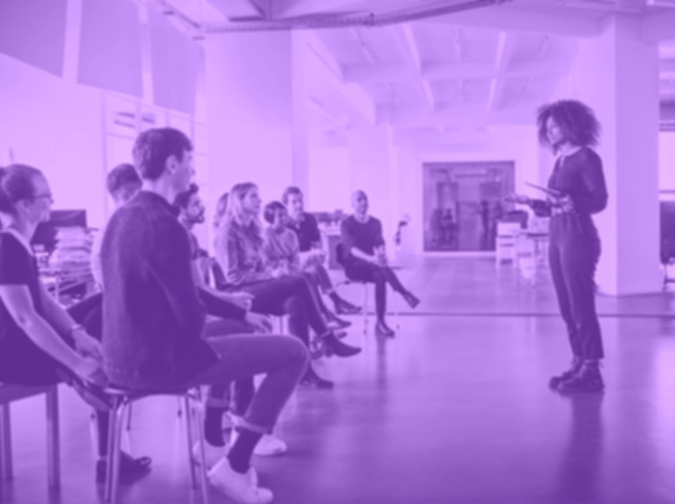 Woman leads Leadership and Organizing Education class.