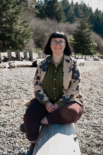 Susan the owner of IFSwellness.com sits at on the beach