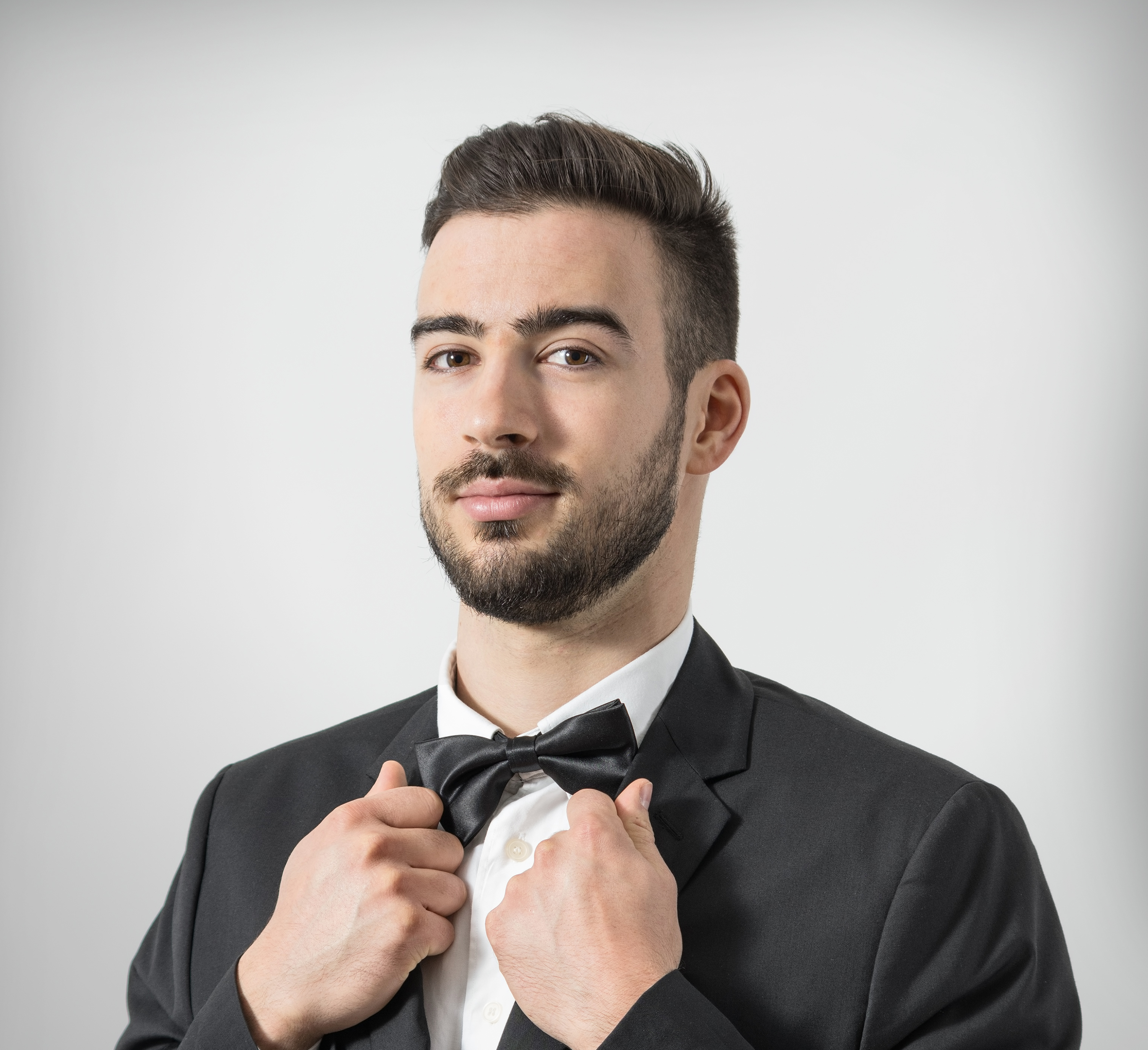 Man Adjusting Bowtie