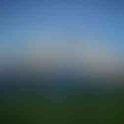 Denali National Park landscape with snow-covered Denali mountain glowing in golden light above spruce forest and tundra in Alaska