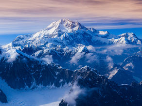 Denali's snowy peaks with ridge and valley details