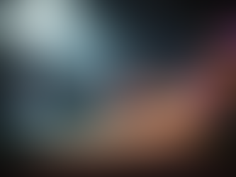 Lush grotto with a waterfall feeding a turquoise pool beside a sandy shore, framed by bright wildflowers and misty light.