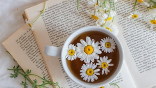 Tea with a book and flowers