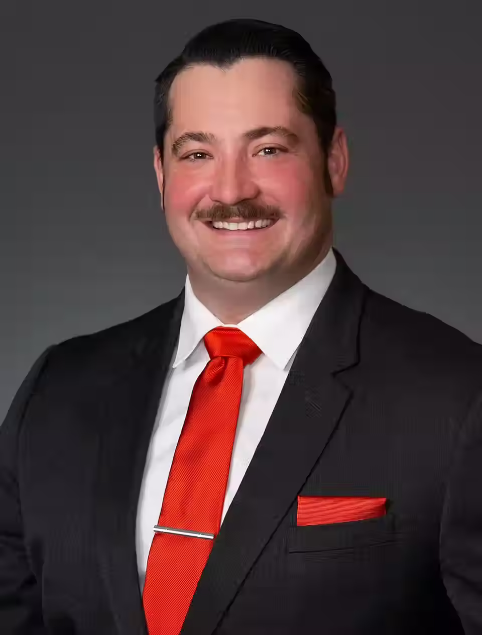 Adam, founder of Dark Sabre Productions, professional headshot highlighting podcast host and political commentator.