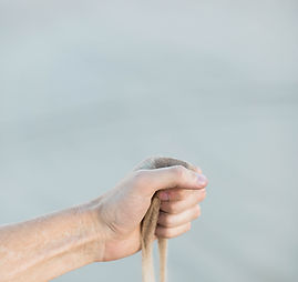 Hand Strewing Sand