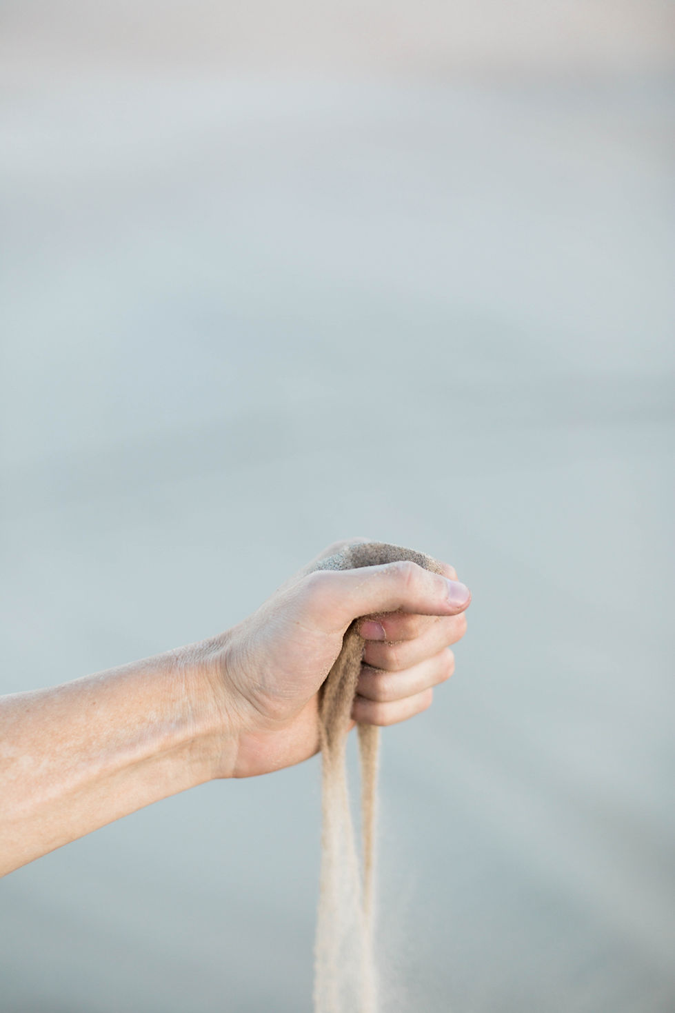 Hand Strewing Sand