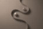 Two balls nesting between a twisted shape reepresenting flow state and high performance