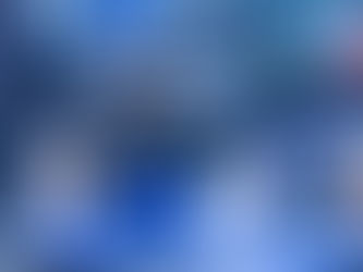 Close-up of an industrial 3D printer creating a blue plastic component for manufacturing.