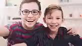 Bright Braces patient smiles after having braces removed in Katy.